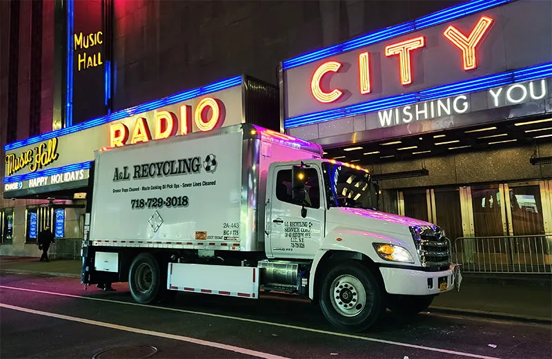 A&L Recycling box truck parked outside Radio City Music Hall at night